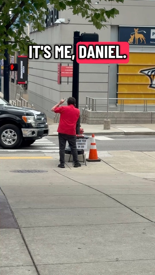 Aaron on a Nashville sidewalk with the PrayPhone
